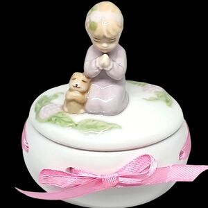 COSMOS porcelain Keepsake box Praying girl with kitten(?). Pink satin ribbon.